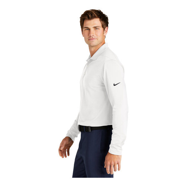 A man wearing a white Nike Dri-Fit polo shirt.