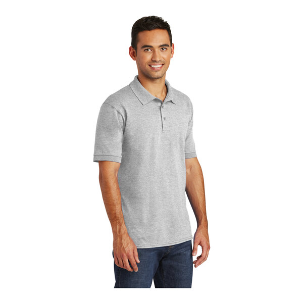 A man wearing a grey Port & Company short sleeve polo shirt.