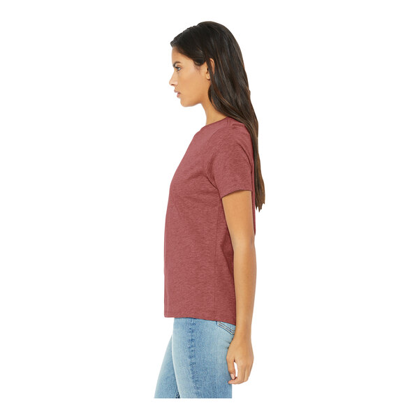 A woman wearing a Bella + Canvas heather mauve short sleeve t-shirt.