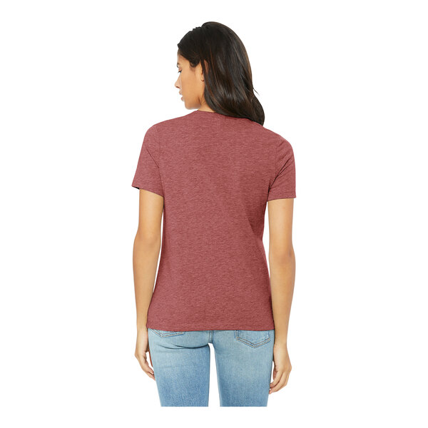 A woman wearing a heather mauve Bella + Canvas women's short sleeve t-shirt.