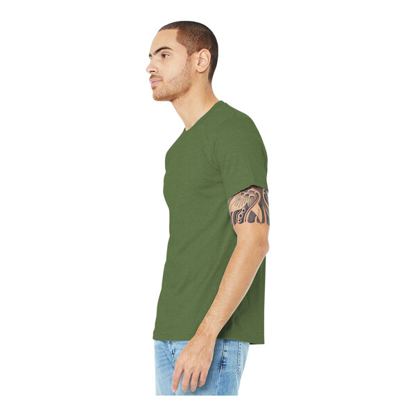 A man wearing a Bella + Canvas heather green short sleeve t-shirt.