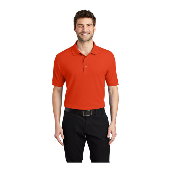 A man wearing a Port Authority® orange polo shirt.