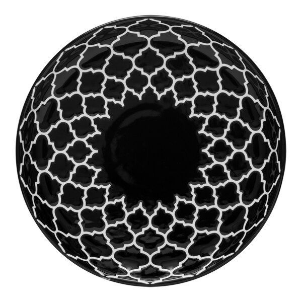 A white porcelain deep coupe plate with a black pattern on the rim.