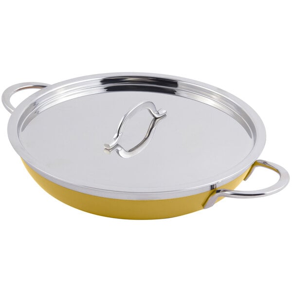 A yellow Bon Chef saute pan with a metal lid and double handles.