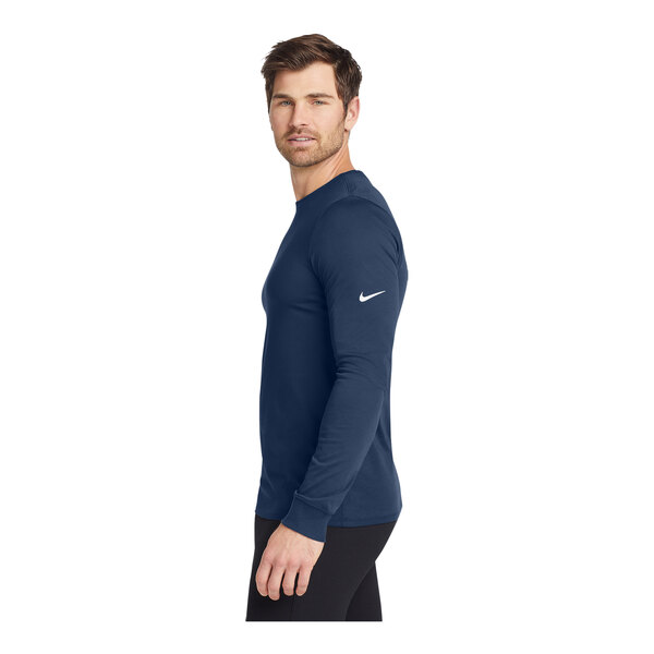 A person wearing a Nike College Navy long sleeve shirt.