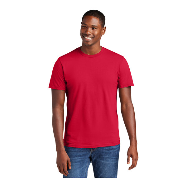 A man wearing a District Classic Red short sleeve T-shirt.