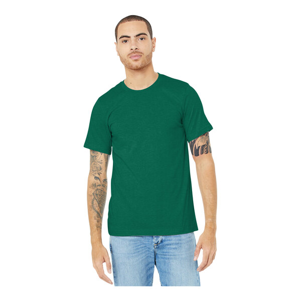 A man wearing a heather grass green Bella + Canvas t-shirt.