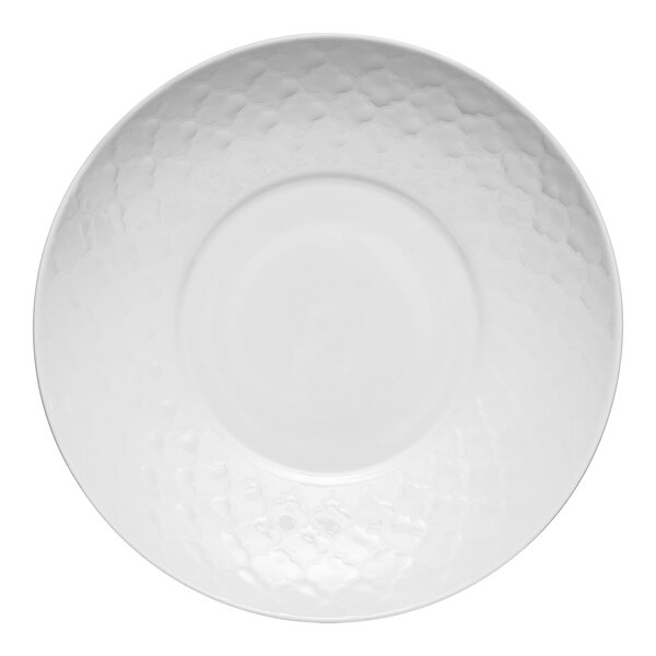 A close-up of a white Libbey Samira deep coupe plate with a textured pattern.