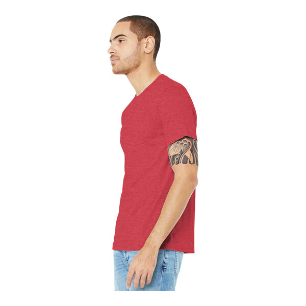 A man wearing a Bella + Canvas heather red t-shirt.