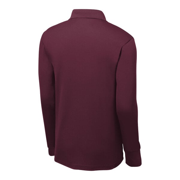 A Sport-Tek unisex maroon long sleeve polo shirt on a mannequin.