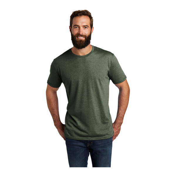 A man with a beard wearing a herb green AllMade T-shirt.