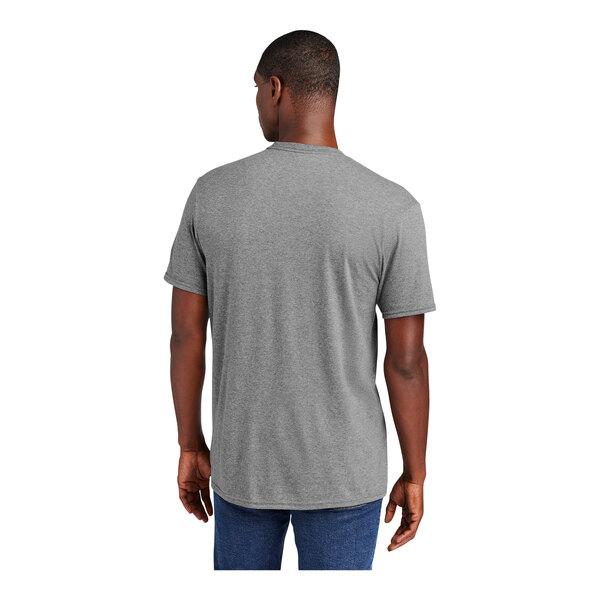 A man wearing a District grey frost short sleeve t-shirt.