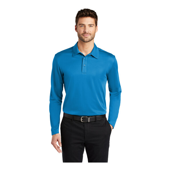 A man wearing a Port Authority Brilliant Blue long sleeve polo shirt with a black collar.
