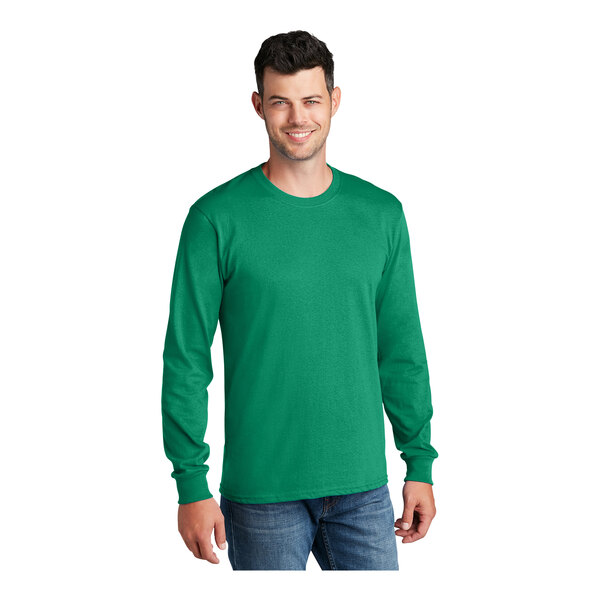 A man wearing a Port & Company long sleeve T-shirt in kelly green.