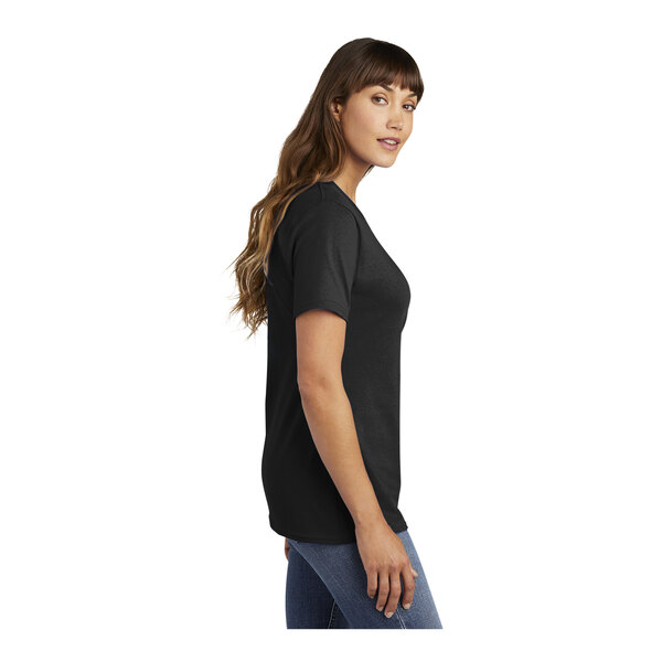 A woman wearing a Jet Black Port & Company t-shirt.