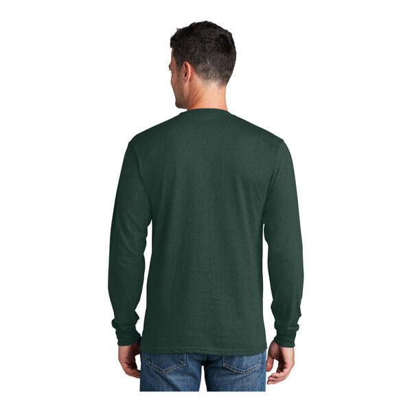 A man wearing a dark green Port & Company long sleeve t-shirt.