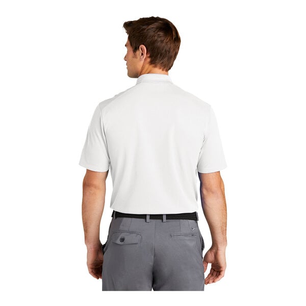 A man wearing a white Nike polo shirt.