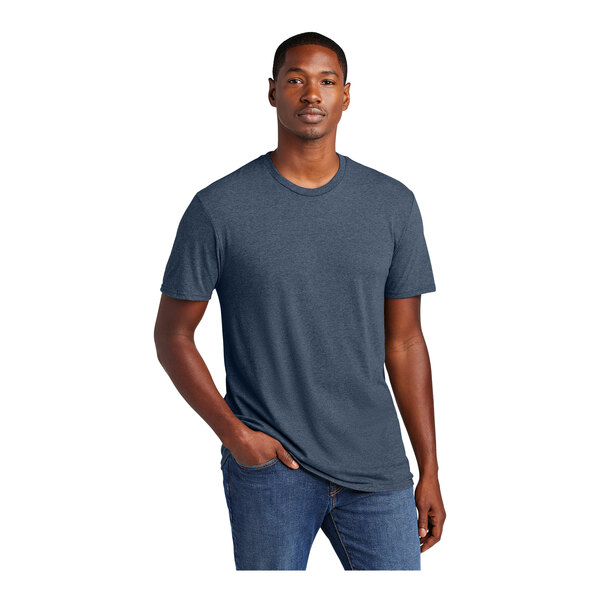 A man wearing a heathered blue District t-shirt.