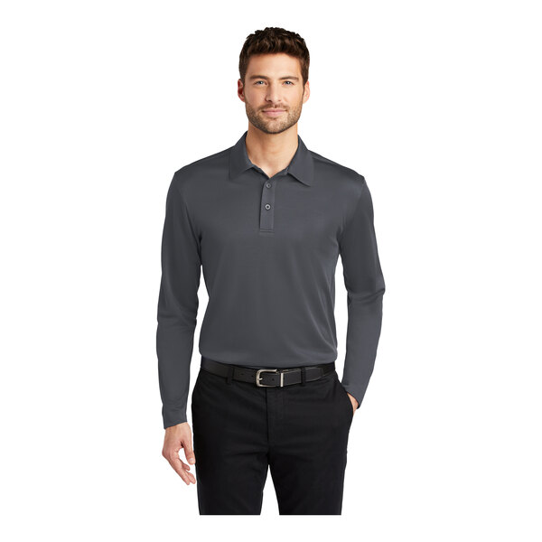 A man wearing a steel gray Port Authority long sleeve polo shirt.