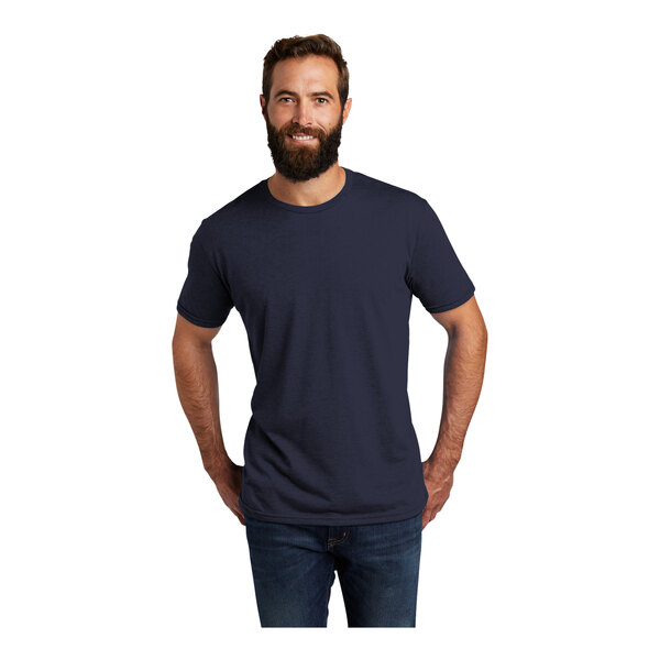 A man with a beard wearing a navy blue AllMade customizable T-shirt.