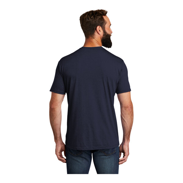 A man with a beard wearing a navy AllMade T-shirt.