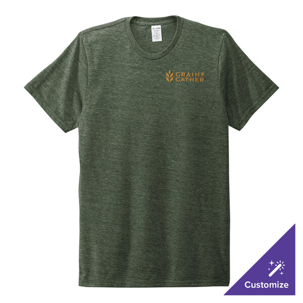 A small herb green AllMade t-shirt with a logo on the counter.