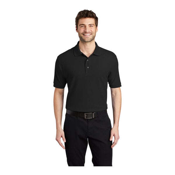 A man wearing a black Port Authority® polo pique® shirt.