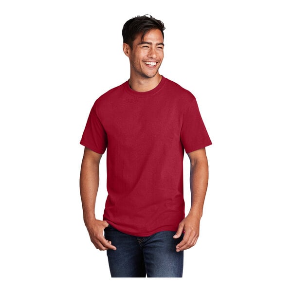A man wearing a red Port & Company T-shirt.