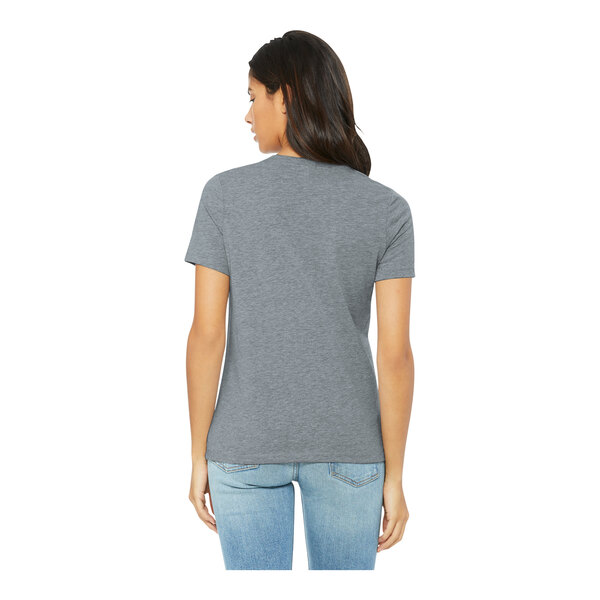 A woman wearing an athletic heather Bella + Canvas customizable short sleeve t-shirt.