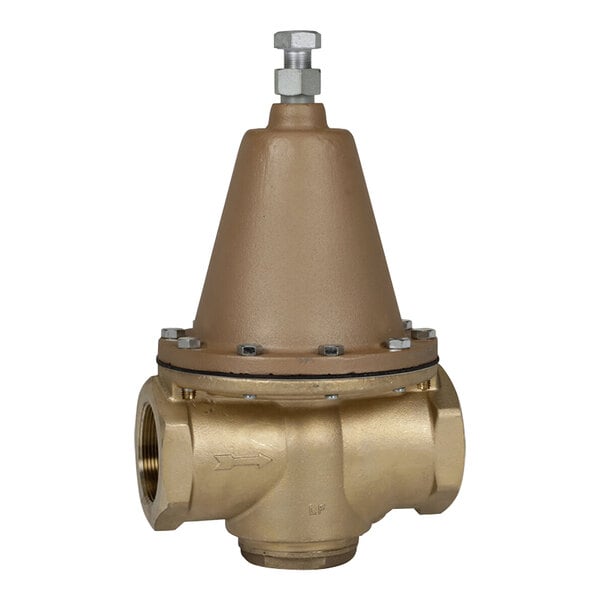 A close-up of a brass Watts water pressure reducing valve with FNPT connections.