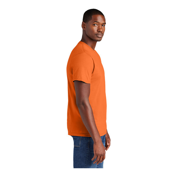 A person wearing a District orange short sleeve t-shirt.
