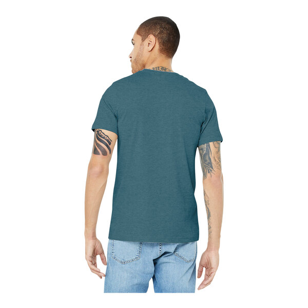 A man wearing a heather slate Bella + Canvas short sleeve t-shirt.