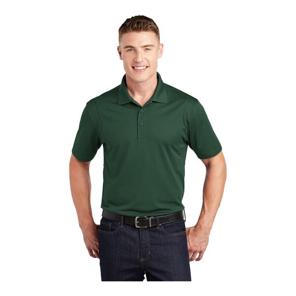 A man wearing a forest green Sport-Tek polo shirt.