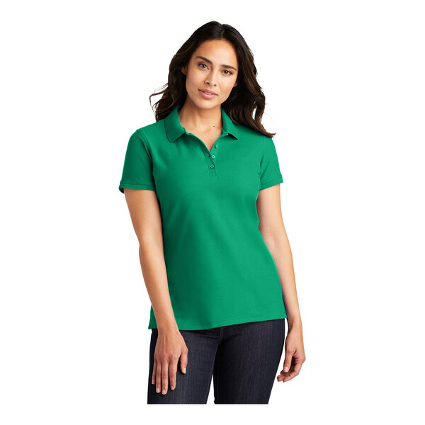 A woman wearing a Port Authority bright Kelly green polo shirt.