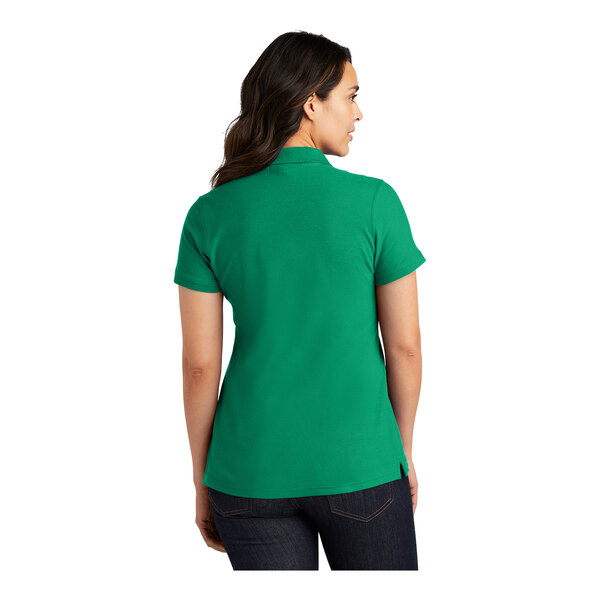 A woman wearing an extra large bright green Port Authority polo shirt.