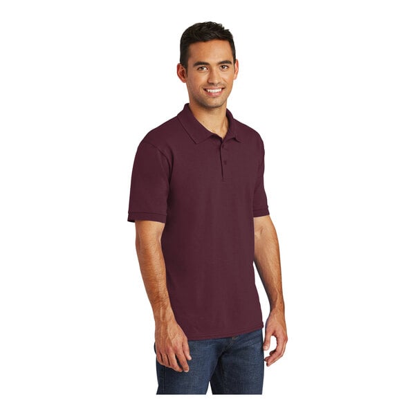 A man wearing a Port & Company maroon polo shirt.
