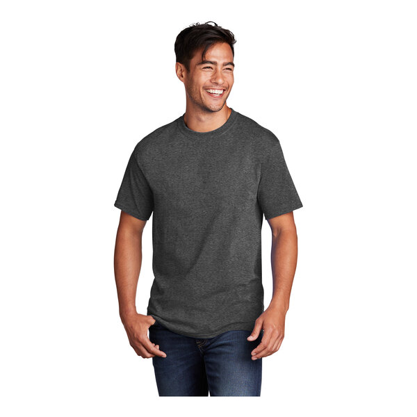 A man wearing a dark heather gray Port & Company T-shirt.