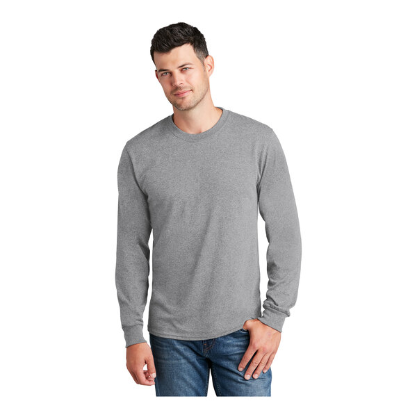 A man wearing a Port & Company athletic heather long sleeve t-shirt.