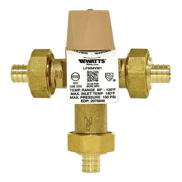 A close-up of a Watts brass thermostatic mixing valve with a white label.