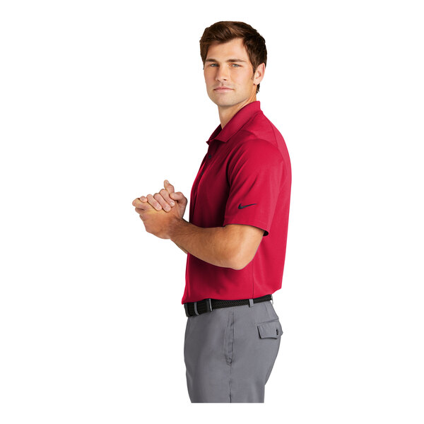 A man wearing a red Nike polo shirt.