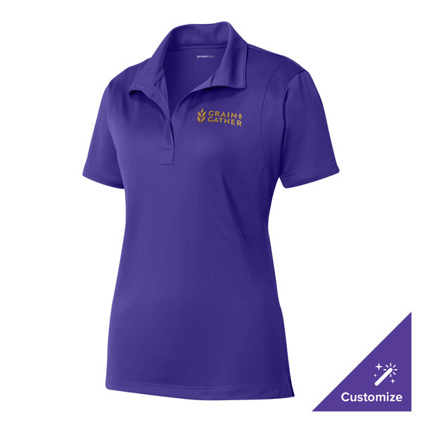 A medium women's purple Sport-Tek polo shirt with a logo on the front.