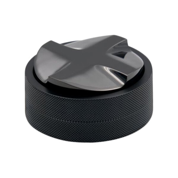 A black Nucleus Coffee Distributor on a counter.