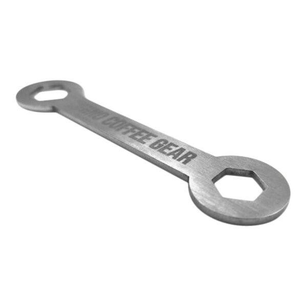 A close-up of a Rhino Coffee Gear dual-size calibration tool with text on it.