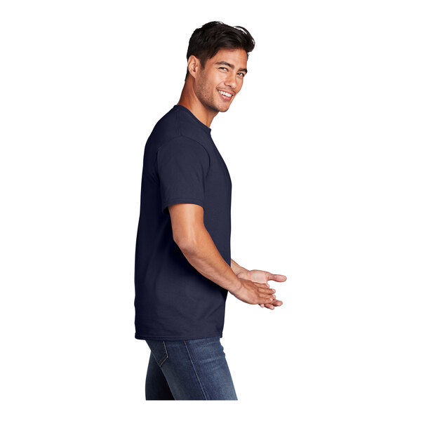 A man in a navy Port & Company short sleeve T-shirt smiling.