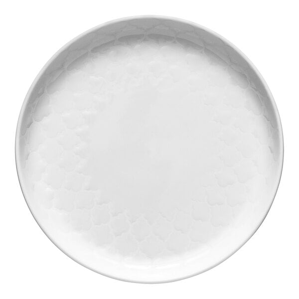 A close-up of a white Libbey Samira porcelain plate with a circular design.