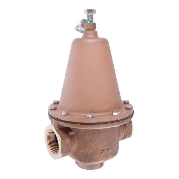 A brown metal Watts water pressure reducing valve.