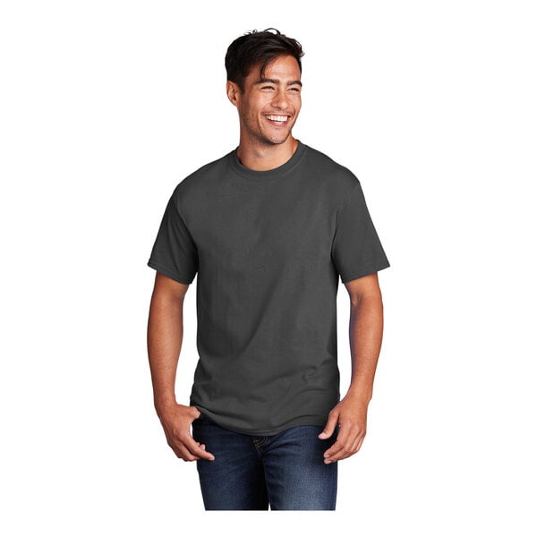 A man smiling and wearing a coal gray Port & Company short sleeve t-shirt.