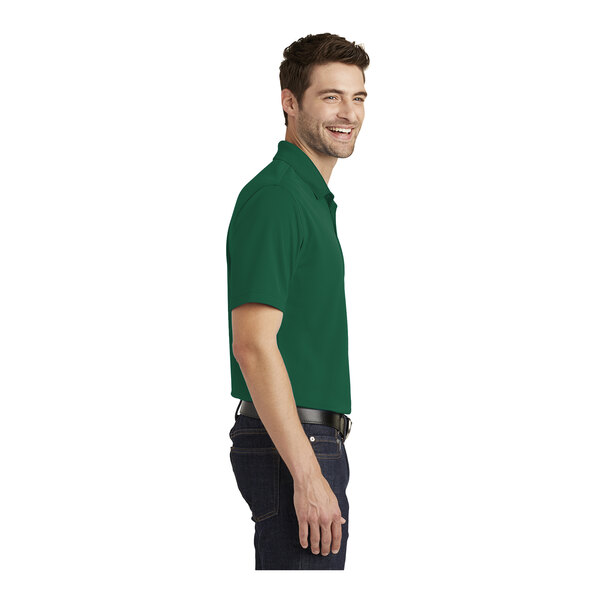 A person wearing a Port Authority Deep Forest Green short sleeve polo shirt.