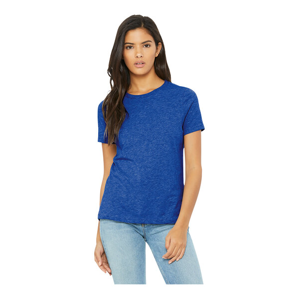 A woman wearing a Bella + Canvas heather true royal short sleeve t-shirt.