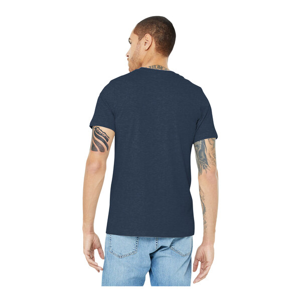 A man wearing a Bella + Canvas heather navy blue t-shirt.